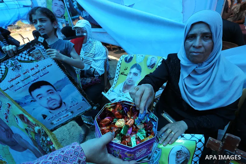 Palestinians celebrate after Palestinian prisoners in Israeli jails suspend hunger strike, in Gaza city on May 27, 2017. Hundreds of Palestinian prisoners on Saturday ended a 40-day hunger strike over conditions in Israe...