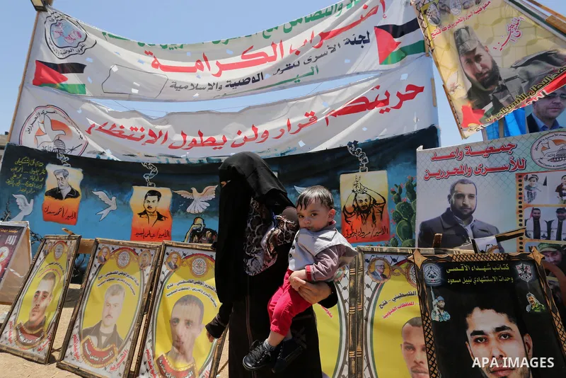 Palestinians celebrate after Palestinian prisoners in Israeli jails suspend hunger strike, in Gaza city on May 27, 2017. Hundreds of Palestinian prisoners on Saturday ended a 40-day hunger strike over conditions in Israe...