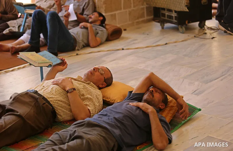 Palestinian men take nap on the first day of fasting in the Muslim holy month of Ramadan, at the al-Omari mosque in Gaza City, on May 27, 2017. Ramadan is sacred to Muslims because it is during that month that tradition...
