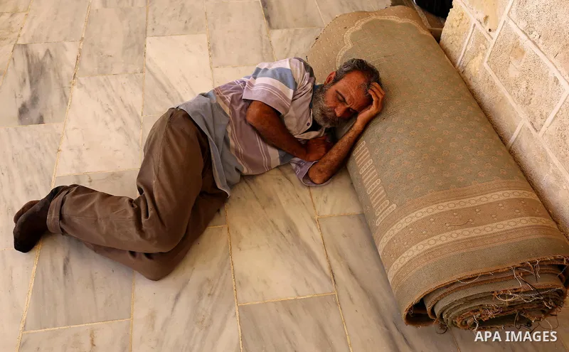 A Palestinian man takes a nap on the first day of fasting in the Muslim holy month of Ramadan, at the al-Omari mosque in Gaza City, on May 27, 2017. Ramadan is sacred to Muslims because it is during that month that tradi...