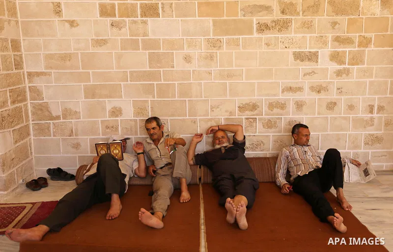 Palestinians read copies of the Koran, Islam's holiest book, on the first day of fasting in the Muslim holy month of Ramadan, at the al-Omari mosque in Gaza City, on May 27, 2017. Ramadan is sacred to Muslims because it...