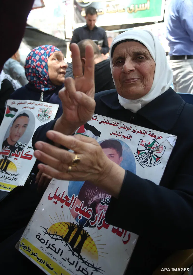 Palestinians celebrate after Palestinian prisoners ended a hunger strike over their conditions in Israeli jails, in the West Bank city of Nablus May 27, 2017. Hundreds of Palestinian prisoners on Saturday ended a 40-day...
