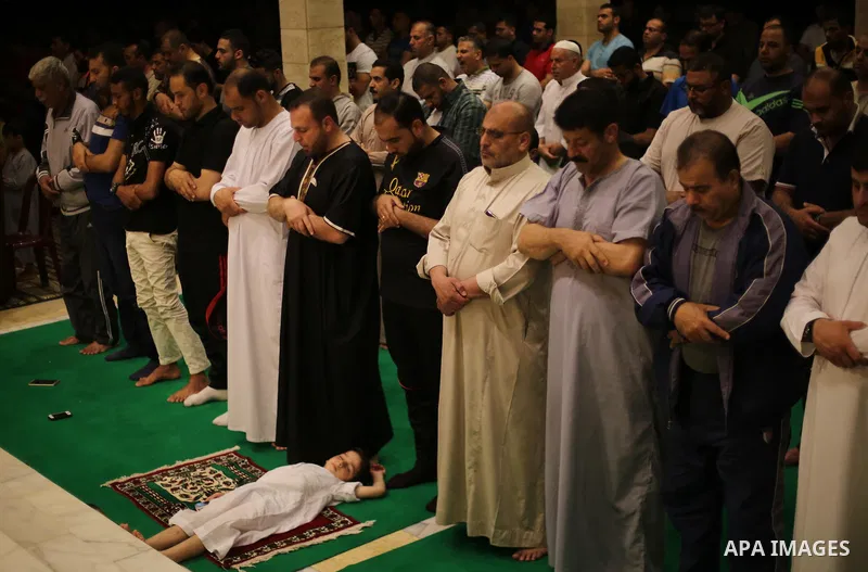 Palestinian Muslim worshipers perform "Taraweeh", nightly prayer of the month of Ramadan, at El Khalidi mosque, in Gaza city, on May 27, 2017. Ramadan is sacred to Muslims because it is during that month that tradition s...