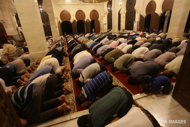 Palestinian Muslim worshipers perform "Taraweeh", nightly prayer of the month of Ramadan, at El Khalidi mosque, in Gaza city, on May 27, 2017. Ramadan is sacred to Muslims because it is during that month that tradition s...