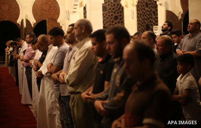 Palestinian Muslim worshipers perform "Taraweeh", nightly prayer of the month of Ramadan, at El Khalidi mosque, in Gaza city, on May 27, 2017. Ramadan is sacred to Muslims because it is during that month that tradition s...