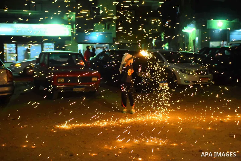 An Egyptian boy plays with fire crackers at street celebrating on the holy month of Ramadan in Cairo Egypt, on May 27, 2017. Ramadan is sacred to Muslims because it is during that month that tradition says the Koran was...