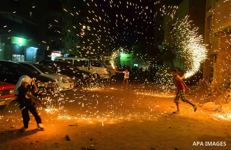 An Egyptian boy plays with fire crackers at street celebrating on the holy month of Ramadan in Cairo Egypt, on May 27, 2017. Ramadan is sacred to Muslims because it is during that month that tradition says the Koran was...