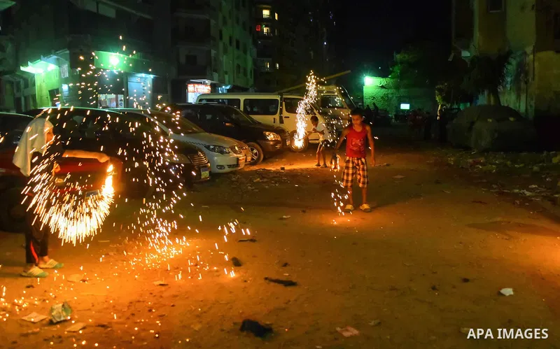 An Egyptian boy plays with fire crackers at street celebrating on the holy month of Ramadan in Cairo Egypt, on May 27, 2017. Ramadan is sacred to Muslims because it is during that month that tradition says the Koran was...
