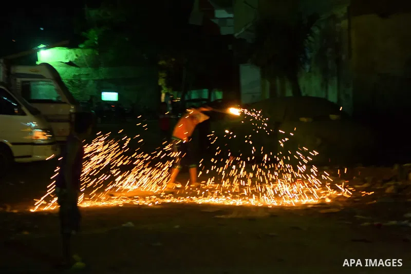 An Egyptian boy plays with fire crackers at street celebrating on the holy month of Ramadan in Cairo Egypt, on May 27, 2017. Ramadan is sacred to Muslims because it is during that month that tradition says the Koran was...
