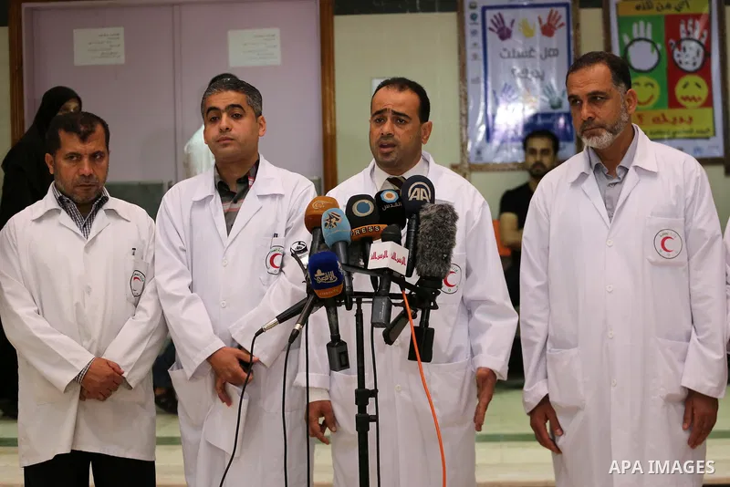 Palestinian doctors hold a press conference about halting shipments of baby formula and medicines to hospitals on Gaza strip, in Gaza city on May 28, 2017. Photo by Mohammed Asad