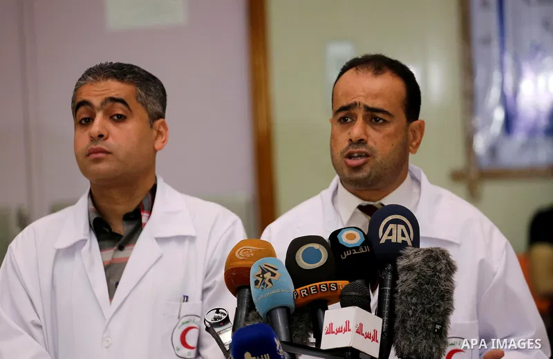 Palestinian doctors hold a press conference about halting shipments of baby formula and medicines to hospitals on Gaza strip, in Gaza city on May 28, 2017. Photo by Mohammed Asad