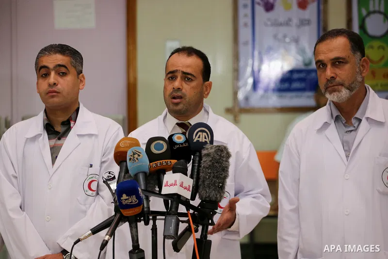 Palestinian doctors hold a press conference about halting shipments of baby formula and medicines to hospitals on Gaza strip, in Gaza city on May 28, 2017. Photo by Mohammed Asad