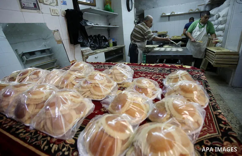 A Palestinian vendor prepares traditional pancakes known as ''Qatayef'' on the Muslim holy fasting month of Ramadan at his shop in the Old City of the West Bank town of Nablus on May 28, 2017. Ramadan is sacred to Muslim...
