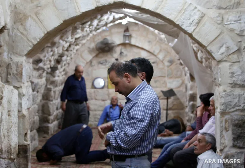Palestinians pray at the al-Hanbali mosque on the Muslim holy fasting month of Ramadan in the Old City of the West Bank town of Nablus on May 28, 2017. Ramadan is sacred to Muslims because it is during that month that tr...