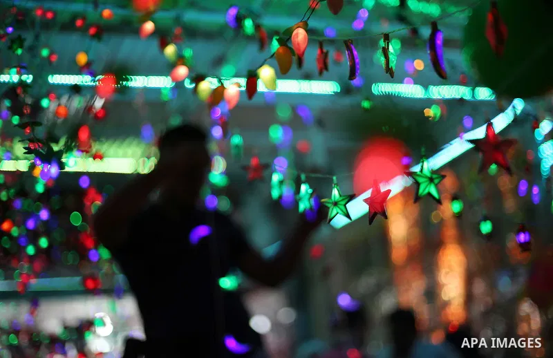 A Palestinian vendor decorates his shop with traditional lanterns known in Arabic as "Fanous" and festive lights on the Muslim holy fasting month of Ramadan on Gaza city on May 28, 2017. Ramadan is sacred to Muslims beca...