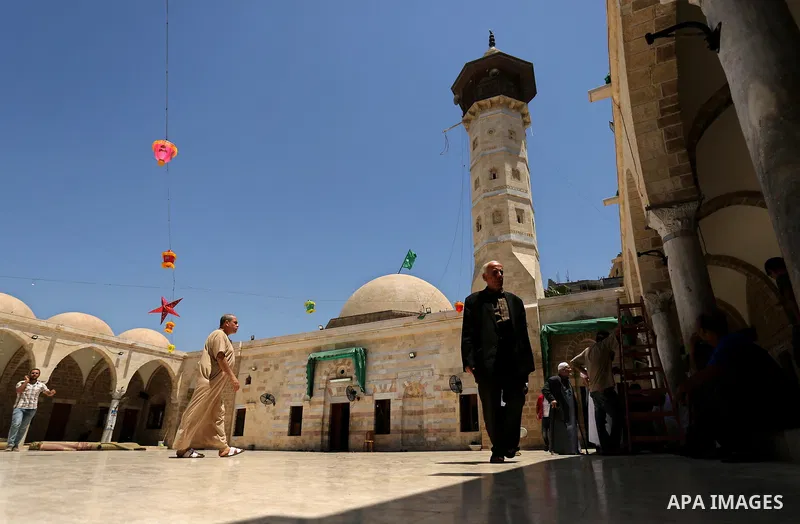 Palestinians walk after prayer at the al- Sayed Hashim mosque on the Muslim holy fasting month of Ramadan in Gaza city on May 29, 2017. Ramadan is sacred to Muslims because it is during that month that tradition says the...