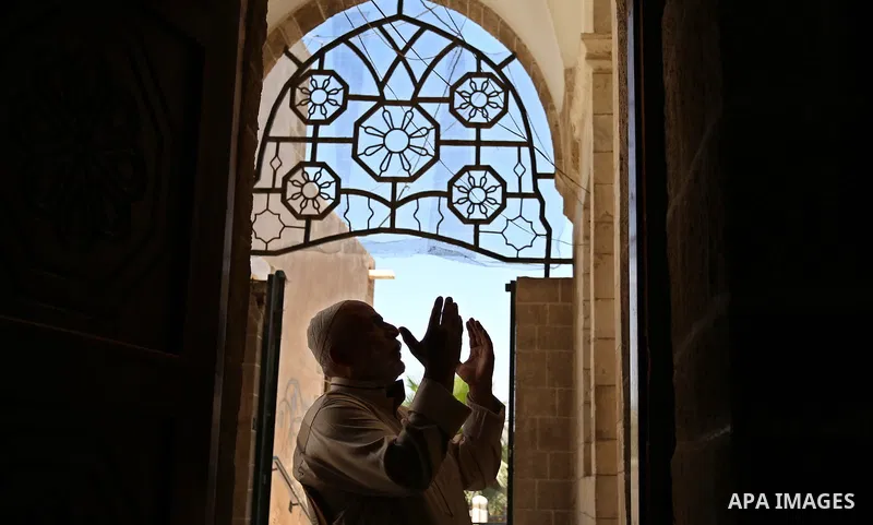 A Palestinian man prays on the Muslim holy fasting month of Ramadan at the al- Sayed Hashim mosque in Gaza city on May 29, 2017. Ramadan is sacred to Muslims because it is during that month that tradition says the Koran...