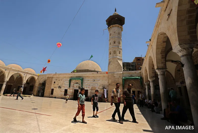 Palestinians walk after prayer at the al- Sayed Hashim mosque on the Muslim holy fasting month of Ramadan in Gaza city on May 29, 2017. Ramadan is sacred to Muslims because it is during that month that tradition says the...