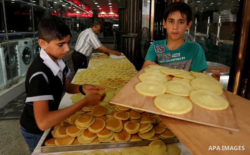 A Palestinian vendor sells traditional pancakes known as ''Qatayef'' on the Muslim holy fasting month of Ramadan at market in Gaza city on May 29, 2017. Ramadan is sacred to Muslims because it is during that month that t...