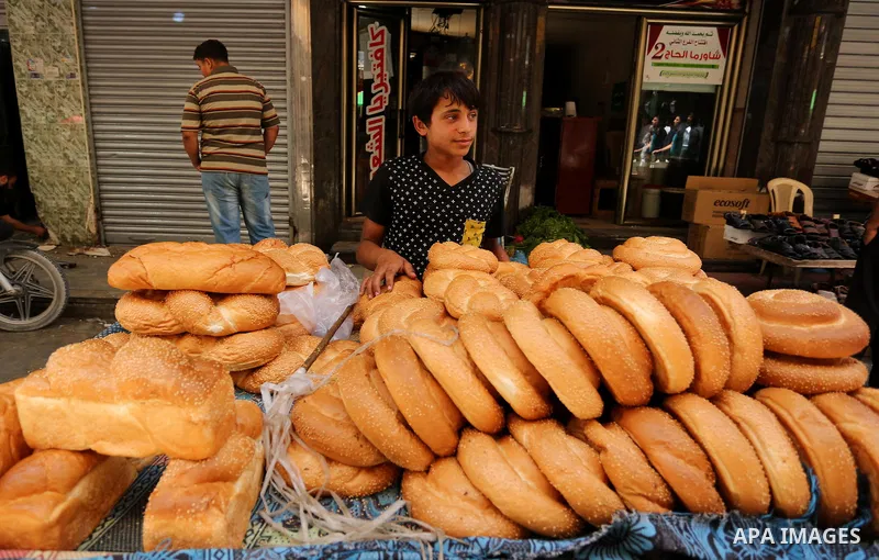 A Palestinian vendor sells bread on the Muslim holy fasting month of Ramadan at market in Gaza city on May 29, 2017. Ramadan is sacred to Muslims because it is during that month that tradition says the Koran was revealed...