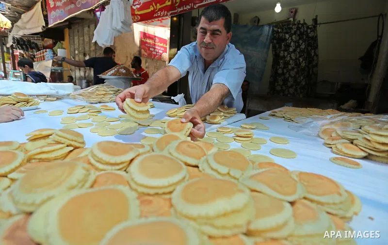 A Palestinian vendor sells traditional pancakes known as ''Qatayef'' on the Muslim holy fasting month of Ramadan at market in Gaza city on May 29, 2017. Ramadan is sacred to Muslims because it is during that month that t...
