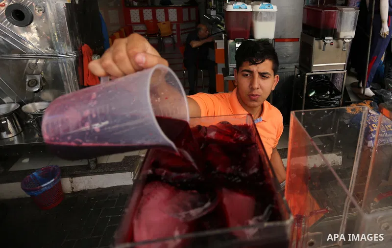 A Palestinian vendor sells Juices on the Muslim holy fasting month of Ramadan at market in Gaza city on May 29, 2017. Ramadan is sacred to Muslims because it is during that month that tradition says the Koran was reveale...