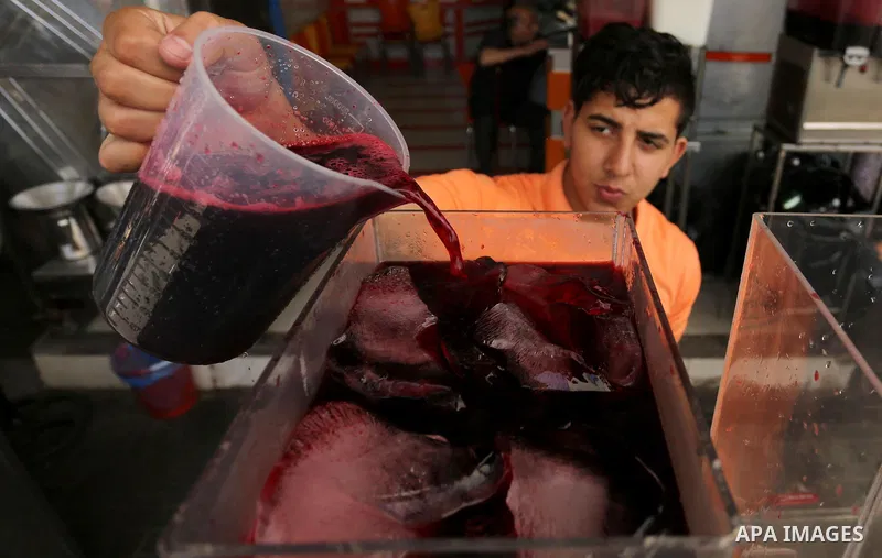 A Palestinian vendor sells Juices on the Muslim holy fasting month of Ramadan at market in Gaza city on May 29, 2017. Ramadan is sacred to Muslims because it is during that month that tradition says the Koran was reveale...