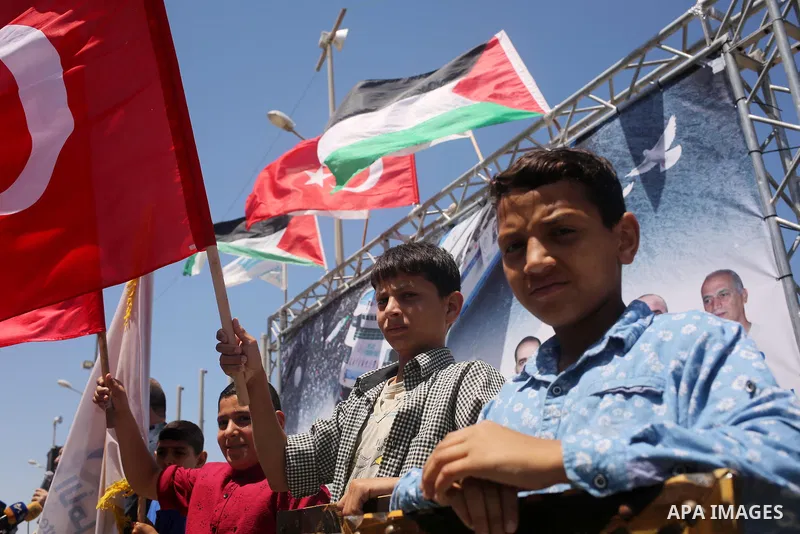 Palestinian children hold the Palestinian and Turkish flags during a rally to mark the 7th anniversary of the Mavi Marmara Gaza flotilla incident, at the seaport of Gaza City May 31, 2017. Nine activists, eight Turkish a...