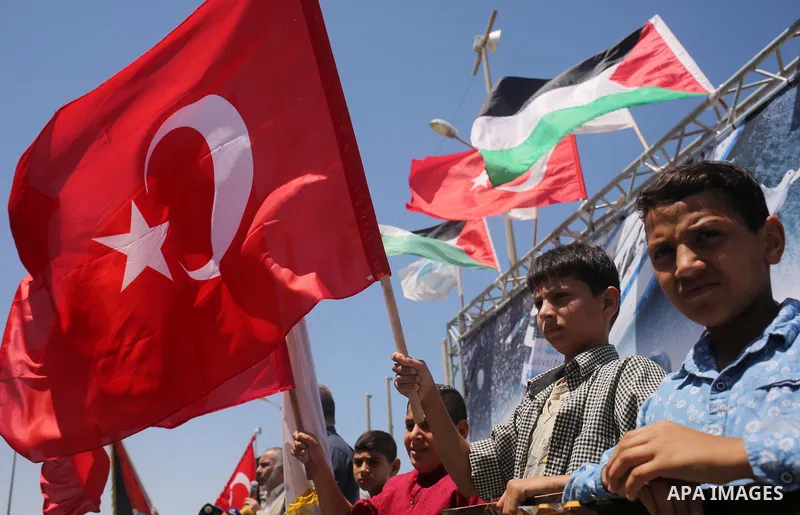 Palestinian children hold the Palestinian and Turkish flags during a rally to mark the 7th anniversary of the Mavi Marmara Gaza flotilla incident, at the seaport of Gaza City May 31, 2017. Nine activists, eight Turkish a...