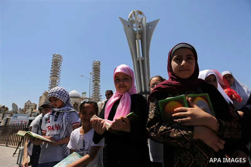 Palestinian children hold copies of Koran during a rally to mark the 7th anniversary of the Mavi Marmara Gaza flotilla incident, at the seaport of Gaza City May 31, 2017. Nine activists, eight Turkish and one Turkish-Ame...