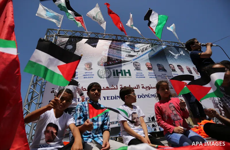 Palestinian children hold the Palestinian and Turkish flags during a rally to mark the 7th anniversary of the Mavi Marmara Gaza flotilla incident, at the seaport of Gaza City May 31, 2017. Nine activists, eight Turkish a...