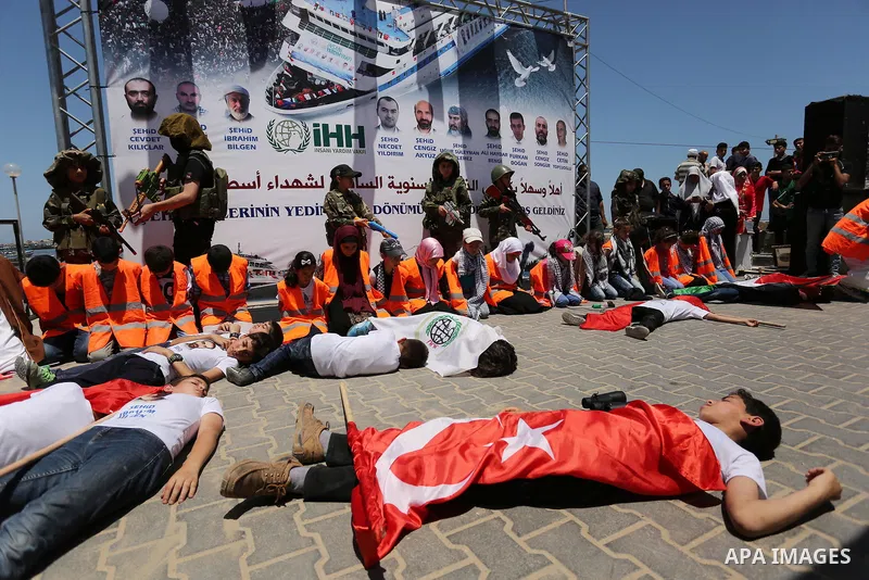 Palestinian children take part during a rally to mark the 7th anniversary of the Mavi Marmara Gaza flotilla incident, as they simulate the raided of Israeli commandos to Mavi Marmara ship, at the seaport of Gaza City May...