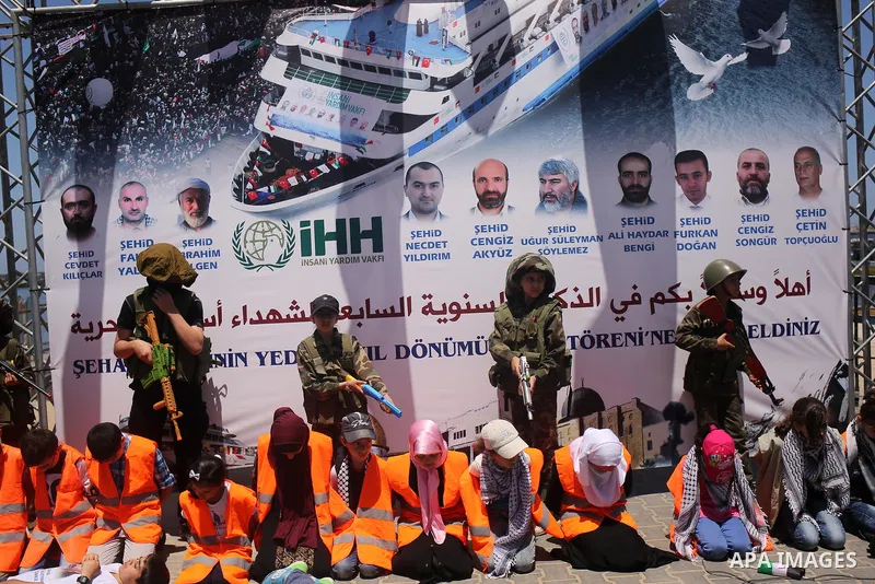 Palestinian children take part during a rally to mark the 7th anniversary of the Mavi Marmara Gaza flotilla incident, as they simulate the raided of Israeli commandos to Mavi Marmara ship, at the seaport of Gaza City May...