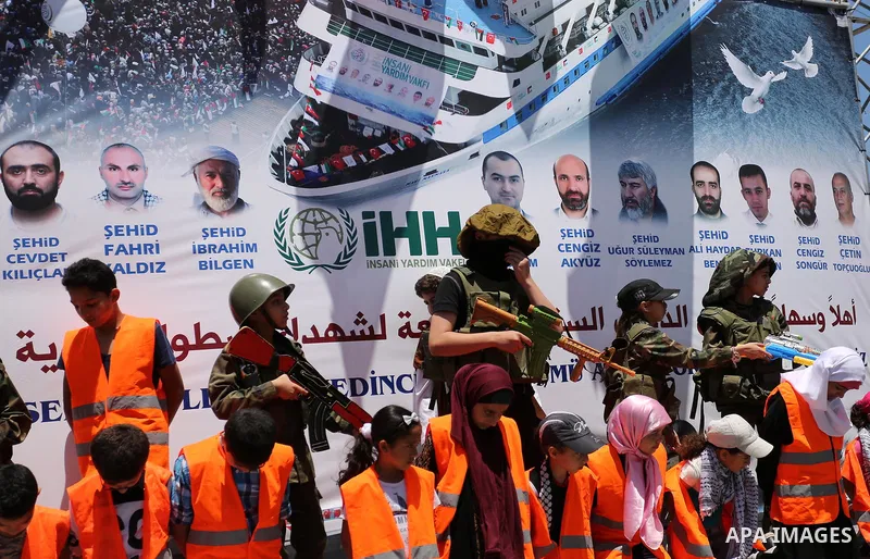 Palestinian children take part during a rally to mark the 7th anniversary of the Mavi Marmara Gaza flotilla incident, as they simulate the raided of Israeli commandos to Mavi Marmara ship, at the seaport of Gaza City May...