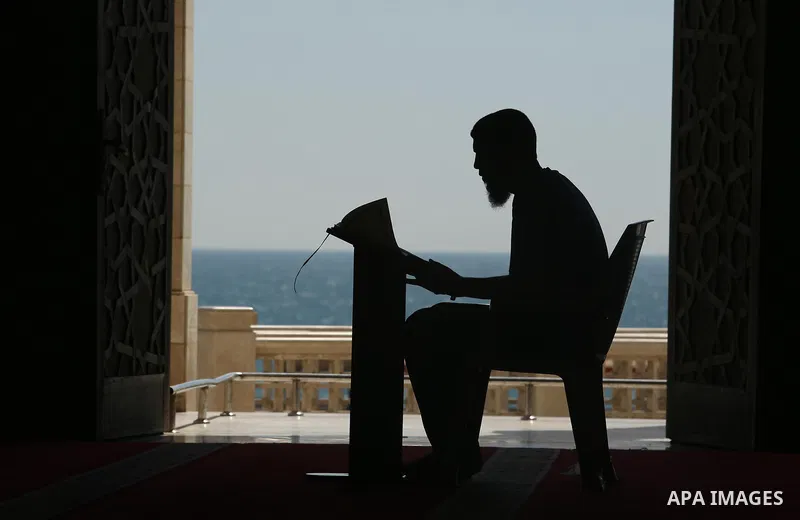 A Palestinian man reads a copy of the Koran, Islam's holiest book, on the Muslim holy fasting month of Ramadan at al-Khaldi mosque in Gaza city on May 31, 2017. Ramadan is sacred to Muslims because it is during that mont...
