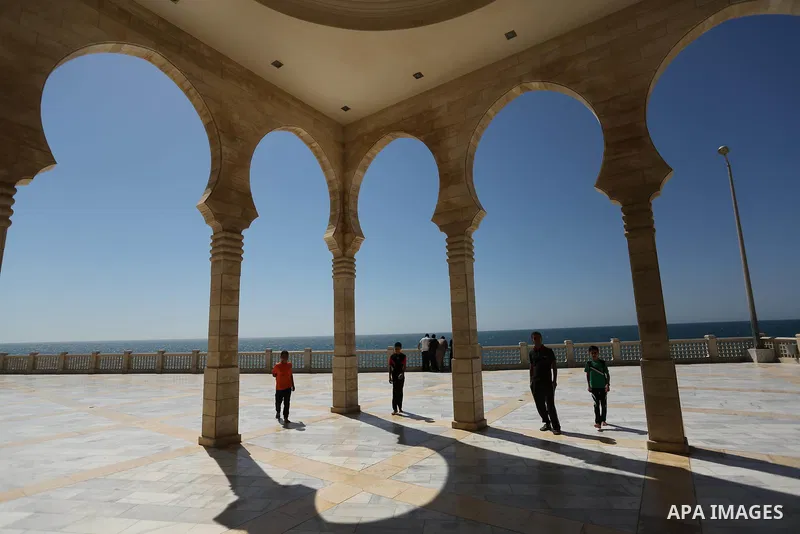 Palestinians walk on the Muslim holy fasting month of Ramadan at al-Khaldi mosque in Gaza city on May 31, 2017. Ramadan is sacred to Muslims because it is during that month that tradition says the Koran was revealed to t...