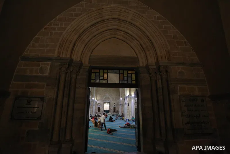 Palestinian men take nap, on the Muslim holy fasting month of Ramadan at the al-Omari mosque in Gaza city on May 31, 2017. Ramadan is sacred to Muslims because it is during that month that tradition says the Koran was re...