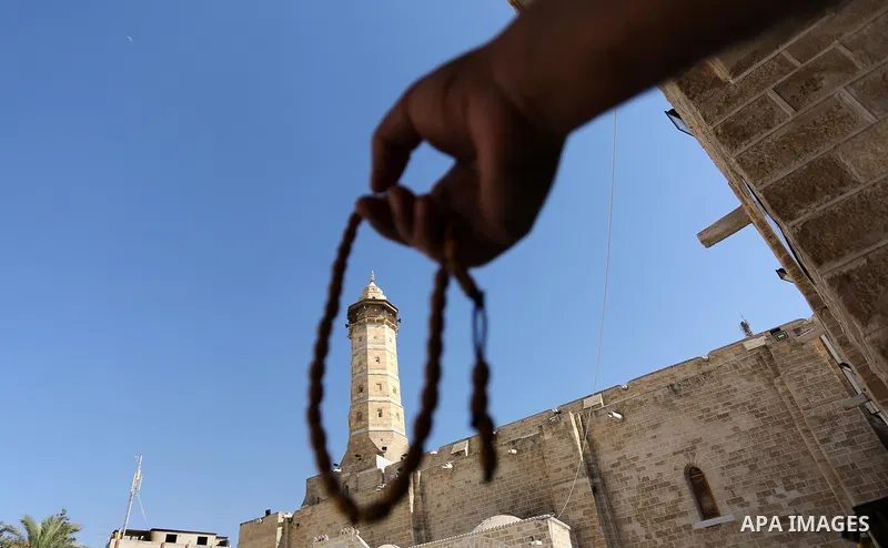 Palestinians pray, on the Muslim holy fasting month of Ramadan at the al-Omari mosque in Gaza city on May 31, 2017. Ramadan is sacred to Muslims because it is during that month that tradition says the Koran was revealed...