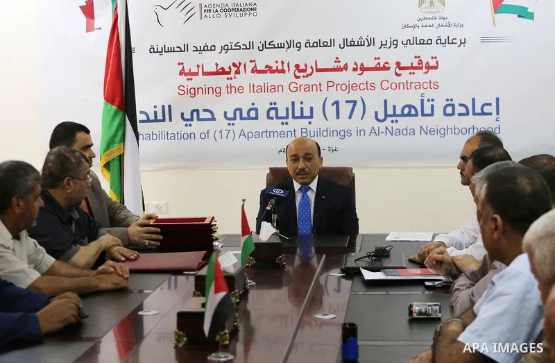 Palestinian Minister of public works and housing, Mofeed al-Hasayna attends the signing the Italian grant projects contracts, in Gaza city on June 01, 2017. Photo by Mohammed Asad