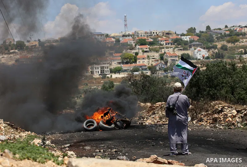 Palestinian protesters clash with Israeli security forces following a demonstration against the expropriation of Palestinian land by Israel in the village of Kfar Qaddum, near Nablus, in the occupied West Bank on June 2,...