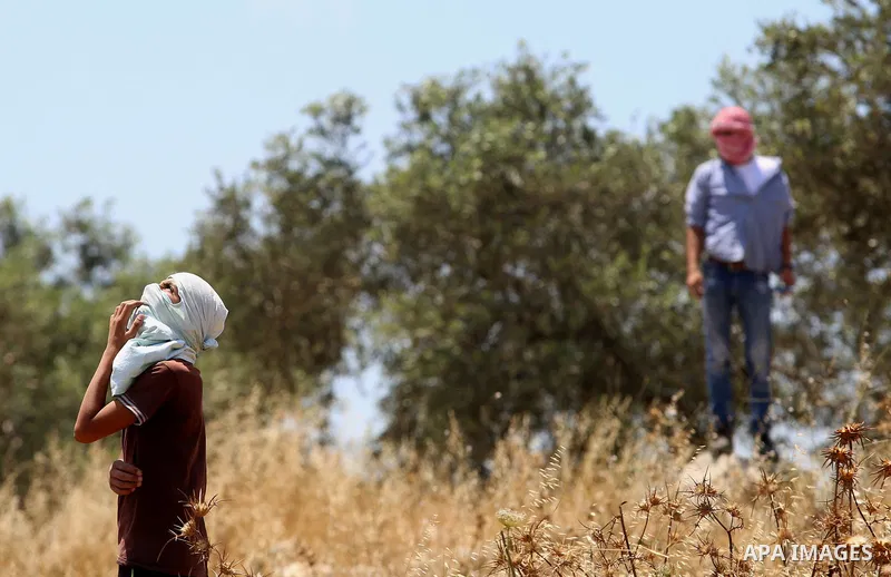 Palestinian protesters clash with Israeli security forces following a demonstration against the expropriation of Palestinian land by Israel in the village of Kfar Qaddum, near Nablus, in the occupied West Bank on June 2,...