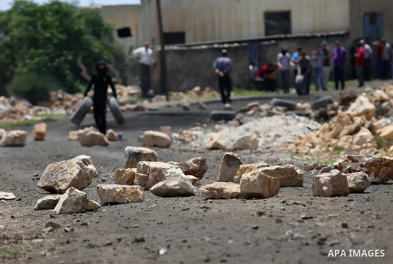 Palestinian protesters clash with Israeli security forces following a demonstration against the expropriation of Palestinian land by Israel in the village of Kfar Qaddum, near Nablus, in the occupied West Bank on June 2,...