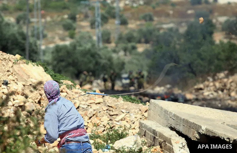 Palestinian protesters clash with Israeli security forces following a demonstration against the expropriation of Palestinian land by Israel in the village of Kfar Qaddum, near Nablus, in the occupied West Bank on June 2,...