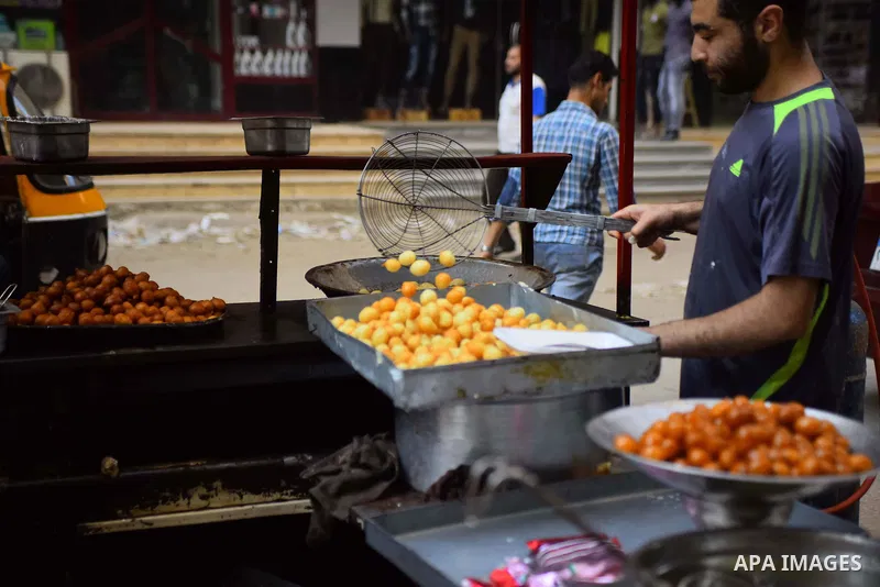 An Egyptian vendor prepares sweets on the Muslim holy fasting month of Ramadan in Cairo, Egypt on June 2, 2017. Ramadan is sacred to Muslims because it is during that month that tradition says the Koran was revealed to t...