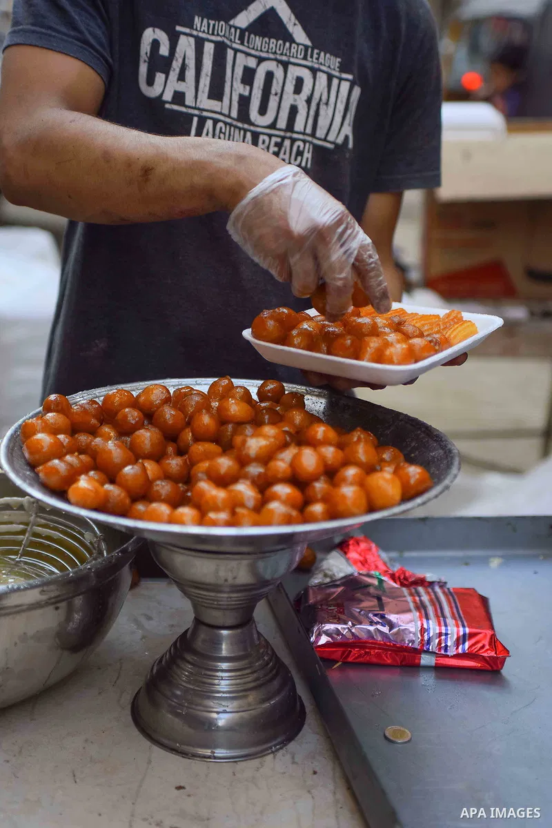 An Egyptian vendor prepares sweets on the Muslim holy fasting month of Ramadan in Cairo, Egypt on June 2, 2017. Ramadan is sacred to Muslims because it is during that month that tradition says the Koran was revealed to t...