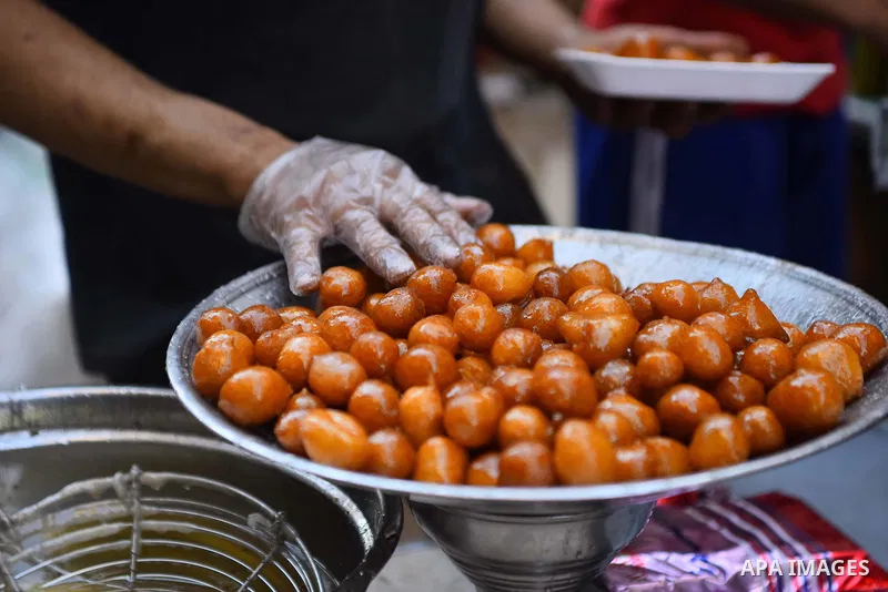 An Egyptian vendor prepares sweets on the Muslim holy fasting month of Ramadan in Cairo, Egypt on June 2, 2017. Ramadan is sacred to Muslims because it is during that month that tradition says the Koran was revealed to t...