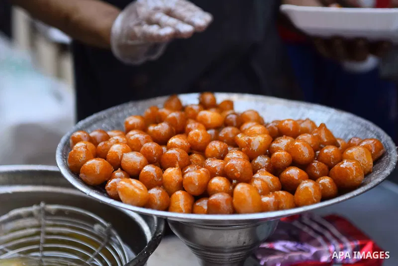 An Egyptian vendor prepares sweets on the Muslim holy fasting month of Ramadan in Cairo, Egypt on June 2, 2017. Ramadan is sacred to Muslims because it is during that month that tradition says the Koran was revealed to t...
