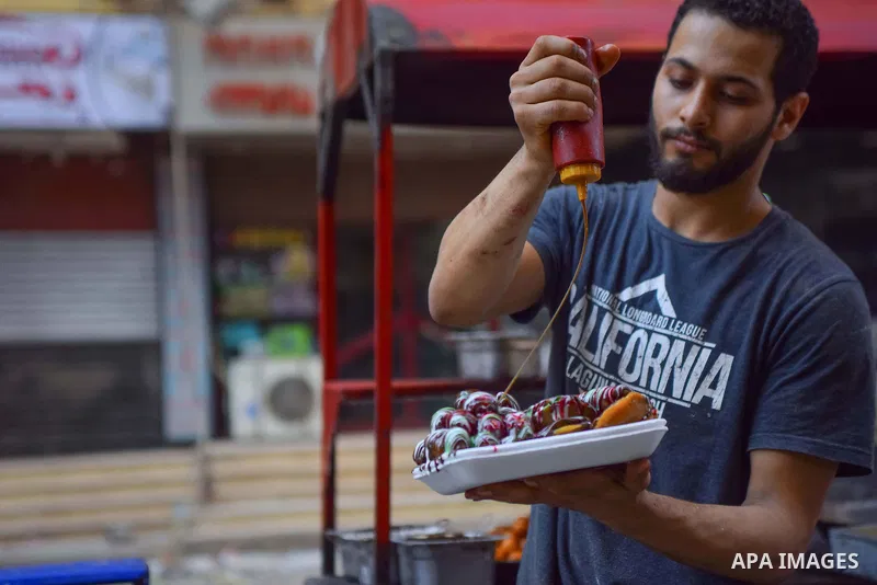 An Egyptian vendor prepares sweets on the Muslim holy fasting month of Ramadan in Cairo, Egypt on June 2, 2017. Ramadan is sacred to Muslims because it is during that month that tradition says the Koran was revealed to t...