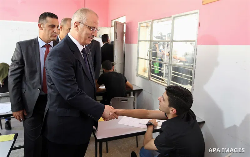 Palestinian Prime Minister Rami Hamdallah visits a school during the first day of high school exams, known as "Tawjihi" in the West Bank city of Nablus on June 03, 2017. Photo by Prime Minister Office