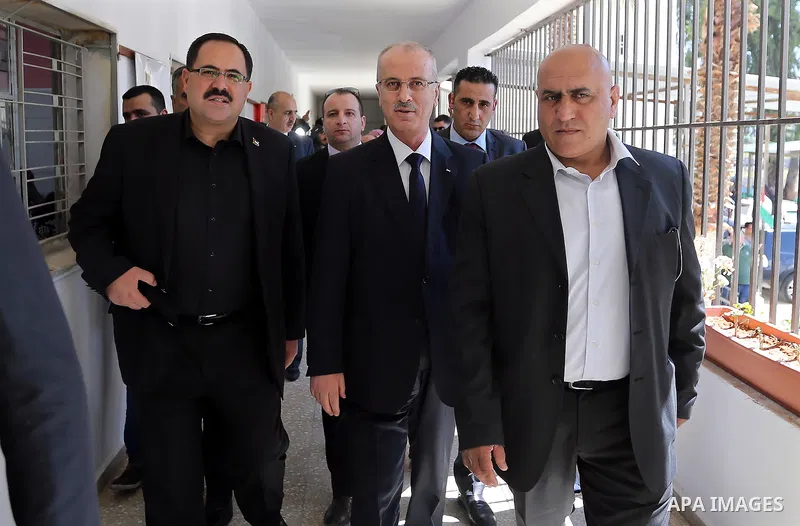 Palestinian Prime Minister Rami Hamdallah visits a school during the first day of high school exams, known as "Tawjihi" in the West Bank city of Nablus on June 03, 2017. Photo by Prime Minister Office